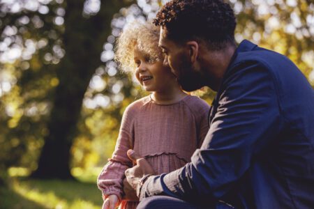 Father and young daughter in park area. Bupa [©Getty/Bupa]